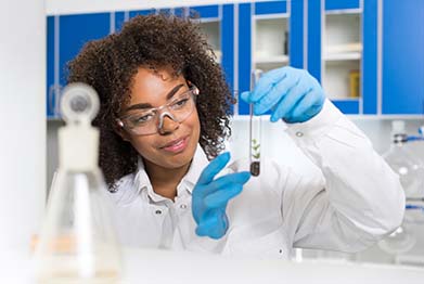 ST-Female Laboratory Scientist Examining Plant