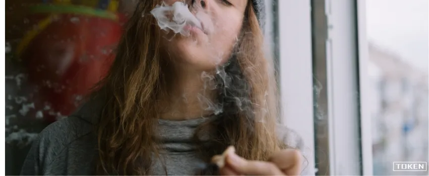 THC - Woman Smoking Roll of Weed